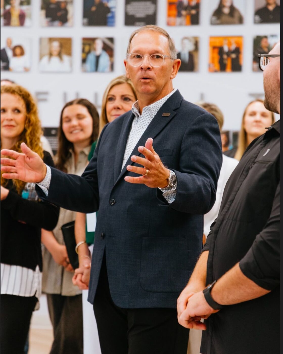 Rex Davis speaking with a group